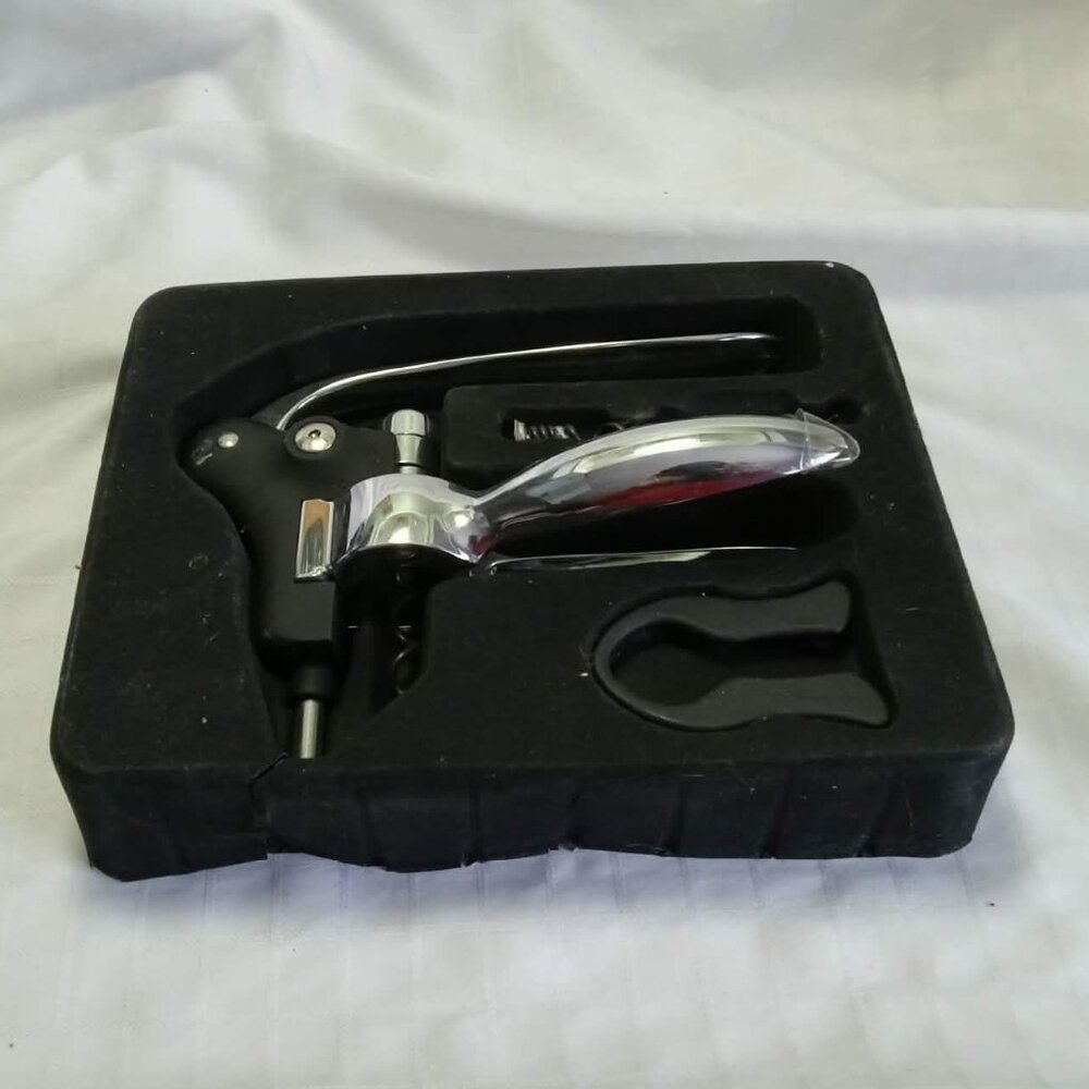 Pro lever bottle opener set, also known as a lever corkscrew, and foil cutter.